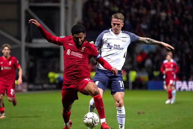 Emil Riis challenges Liverpool defender Joe Gomez at Deepdale
