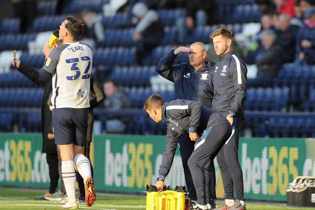 Preston North End head coach Frankie McAvoy with Paul Gallagher on the touchline at Deepdale