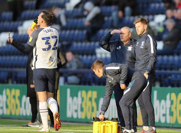 Preston North End head coach Frankie McAvoy with Paul Gallagher on the touchline at Deepdale