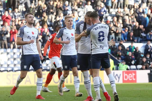 Emil Riis is congratulated by PNE skipper Alan Browne after scoring the second goal from the penalty spot at Deepdale