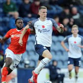 Preston North End striker Emil Riis gets away from Luton Town's Fred Onyedinma at Deepdale