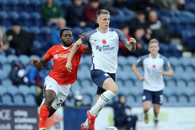 Preston North End striker Emil Riis gets away from Luton Town's Fred Onyedinma at Deepdale