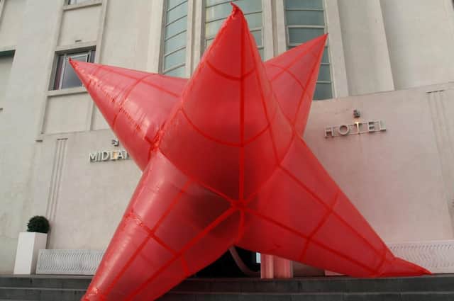 A Now You See It giant inflatable created by young people appears outside Morecambe's famous Midland Hotel.