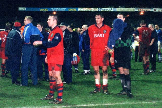The PNE players are forced to wait on the pitch at full-time after the lights blew in the dressing room at Macclesfield