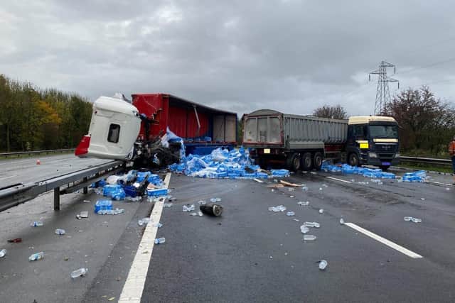 The collision caused one of the lorries to shed hundreds of water bottles onto the carriageway