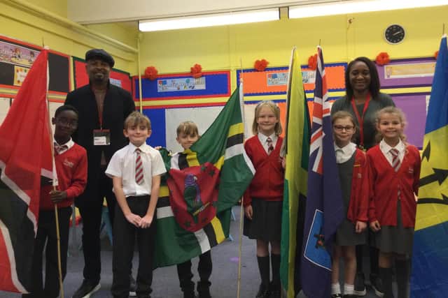 Adrian Murrell from Windrush Initiatives CIC visited the school, pictured from left to right is Algreia, Adrian Murrell, Leon, Riley, Nancy, Lilly-Mae, Miss Judith Ward, and Tilly.