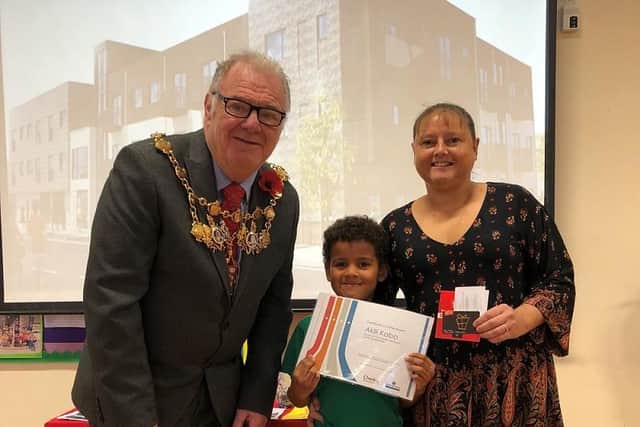 Mayor of Chorley presented seven-year-old Akili with his prize.