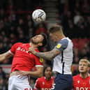 Preston North End defender Patrick Bauer challenges in the air against Nottingham Forest at the City Ground