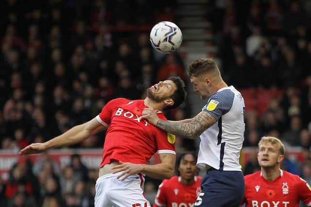 Preston North End defender Patrick Bauer challenges in the air against Nottingham Forest at the City Ground