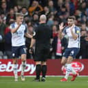 Preston North End's Ali McCann, Ben Whiteman and Daniel Johnson dispute the award of Nottingham Forest's penalty at the City Ground