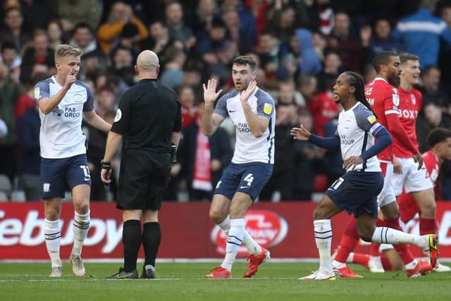 Preston North End's Ali McCann, Ben Whiteman and Daniel Johnson dispute the award of Nottingham Forest's penalty at the City Ground