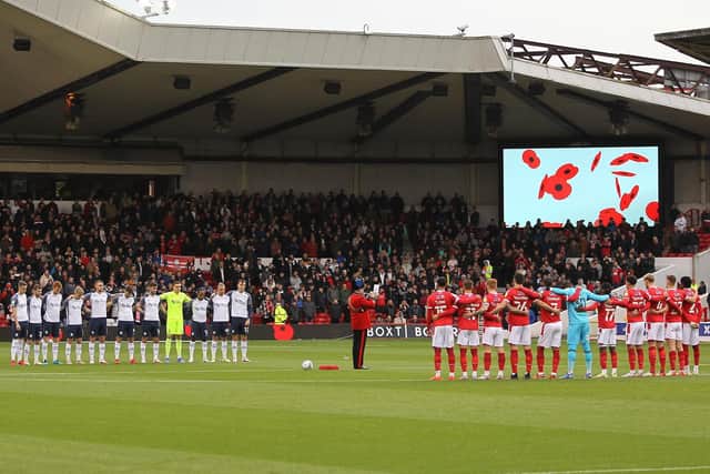 PNE and Nottingham Forest players observe a minute's silence before the game at the City Ground