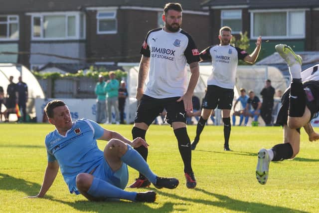 Chorley's Scott Leather, left, and Brig's Mark Yeates clash the last time the two clubs met in a pre-season friendly at Irongate