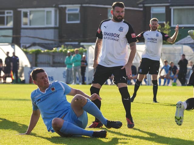 Chorley's Scott Leather, left, and Brig's Mark Yeates clash the last time the two clubs met in a pre-season friendly at Irongate