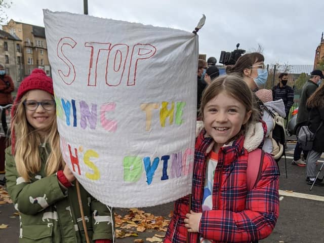 Isla Bradbury and Esme Donald both pupils of St Wilfrid's Primary in Halton with their banner as they took part in Greta's march in Glasgow during COP26.