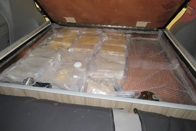 Almost 20 kilos of heroin was found in a concealment which had been built into a storage compartment at the rear of the van (Credit: National Crime Agency)