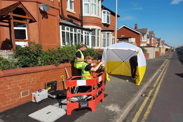 ITS engineers installing the fast fibre in existing street infrastructure