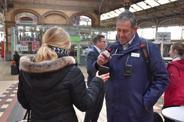 Checking a mobile phone ticket at Preston station