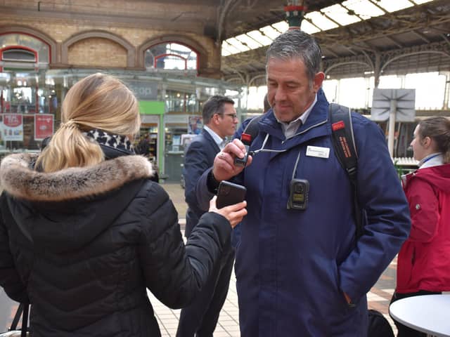 Checking a mobile phone ticket at Preston station