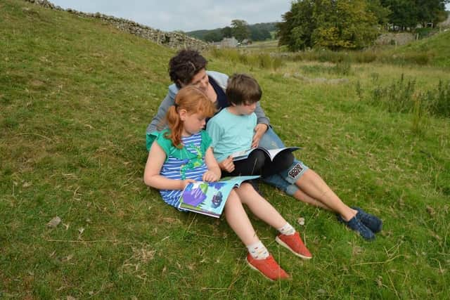 Jane reading to Charlotte and Matthew