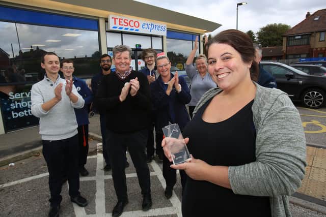 Tesco Race for Life Hero Award winner Suzie Alves receives her award from area manager Ian Hamer and her colleagues at Blackpool Road Tesco Express. 
 Picture: George Carrick Photography