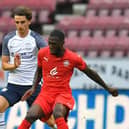 Tom Bayliss in action for Preston North End against Wigan Athletic at the DW Stadium in July