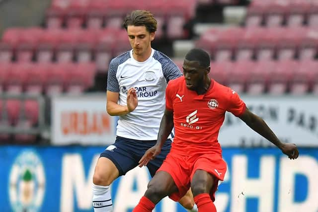 Tom Bayliss in action for Preston North End against Wigan Athletic at the DW Stadium in July