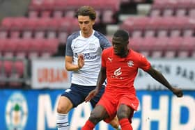 Tom Bayliss in action for Preston North End against Wigan Athletic at the DW Stadium in July