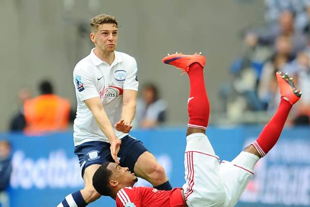 Calum Woods makes a challenge during PNE's play-off final win over Swindon at Wembley in May 2015