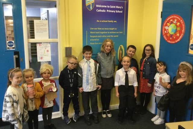 The pupils of St. Mary's Catholic School in Preston dressed as their teachers for the day.