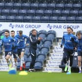 North End warm-up ahead of the game against Cardiff City at Deepdale