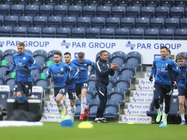North End warm-up ahead of the game against Cardiff City at Deepdale