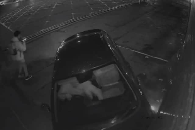 CCTV footage shows the driver narrowly missing a passerby walking past at the time of the crash