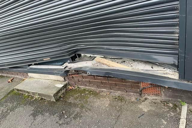 The crash has damaged the salon shutters and brickwork, as well as smashing a window