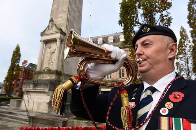 Bugler Darryl Cartwright pictured playing the Last Post at the Remembrance Day service at the cenotaph in Preston                                         Photo: Neil Cross
