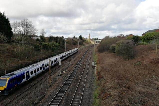 The narrow bridge on Bee Lane crosses the West Coast Mainline