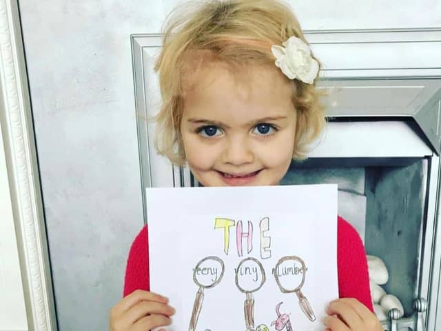 Four-year-old Evie who has written a book entitled Teeny Tiny Plumber to raise funds for Derian House Children's Hospice.