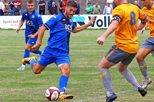 Paul Dawson on the ball for Lancaster City