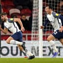 Ched Evans turns to celebrate, pursued by Josh Earl, after scoring Preston North End's equaliser against Middlesbrough