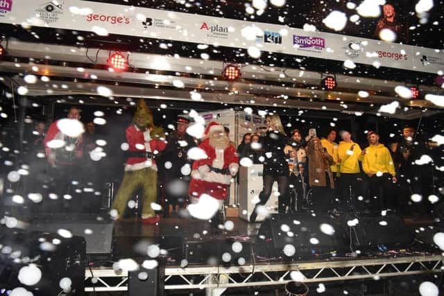 Father Christmas and the Grinch take to the stage during Saturday's Christmas Lights Switch On in Preston