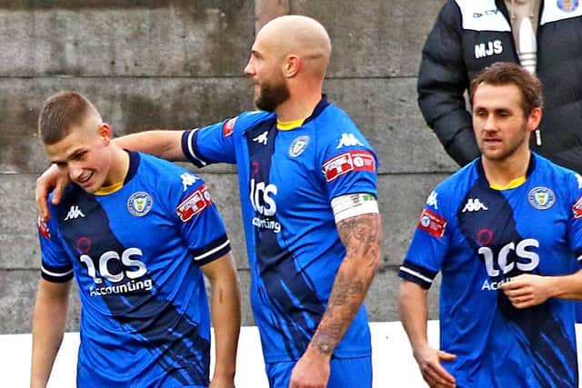 Lewis Fensome, left, is congratulated by Andy Teague and Christian Sloan after hitting the winning goal against Buxton on Saturday (photo: Tony North)