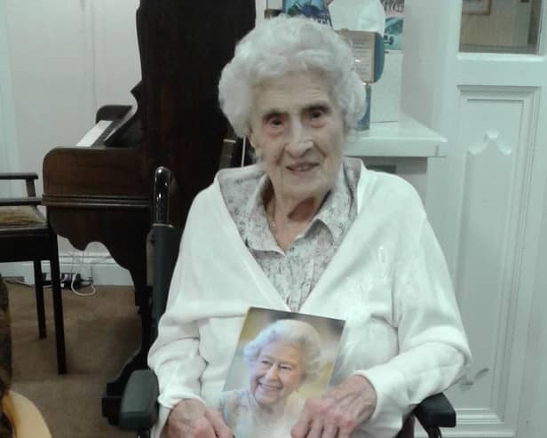 Frances Compston with her telegram from the Queen for her 100th birthday.
