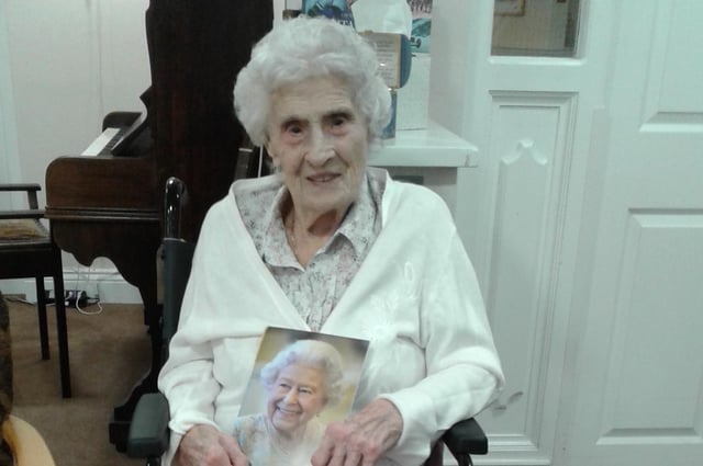 Frances Compston with her telegram from the Queen for her 100th birthday.