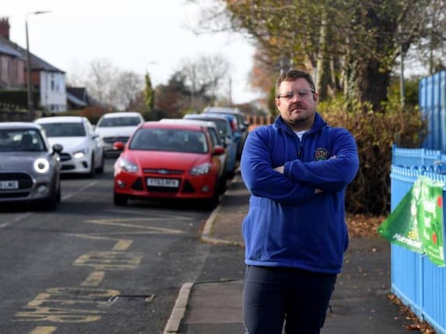 Headteacher James Maloney outside his school