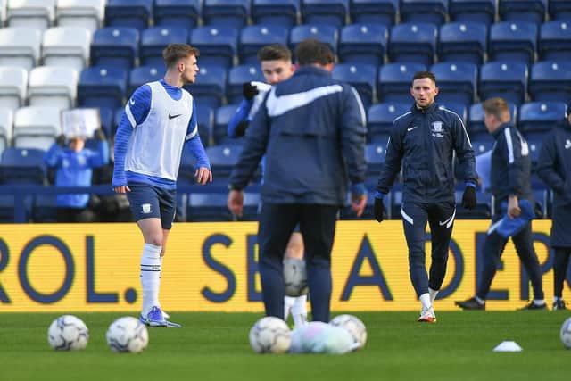 Preston North End players warm-up before the game against Fulham at Deepdale