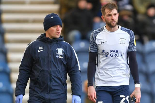 Preston North End wing-back Tom Barkhuizen walks to the tunnel with physio Matt Jackson