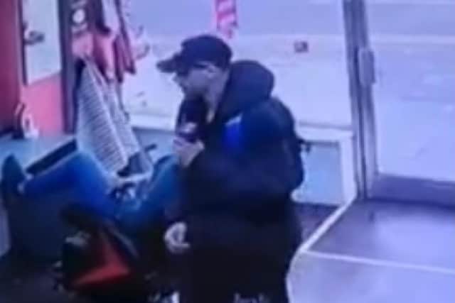 Police want to speak to a man following a "racist incident" at a barber shop in Preston (Credit: Lancashire Police)