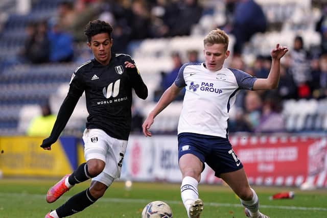 PNE midfielder Ali McCann makes a challenge against Fulham
