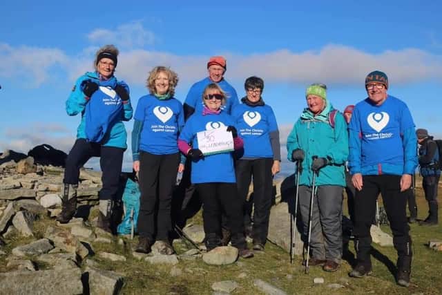 Jackie at the summit of Ingleborough with members of Clitheroe Mountaineering Club. Photo credit: Richard Cook
