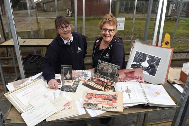 Margaret and Susan pictured with part of their collection of nursery memorabilia and photos